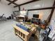 Spacious garage area with concrete floors, workbench, and ample storage space at 3341 S Big Sky Way, Pahrump, NV 89048