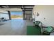 Spacious garage area with concrete floors, workbench, and ample storage space at 3341 S Big Sky Way, Pahrump, NV 89048