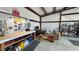 Spacious garage area with concrete floors, workbench, and ample storage space at 3341 S Big Sky Way, Pahrump, NV 89048