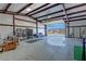 Spacious garage area with concrete floors, workbench, and ample storage space at 3341 S Big Sky Way, Pahrump, NV 89048