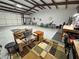 Spacious garage area with concrete floors, workbench, and ample storage space at 3341 S Big Sky Way, Pahrump, NV 89048