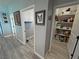 Hallway featuring the laundry, pantry and access to the bedrooms with matching gray-toned flooring at 3341 S Big Sky Way, Pahrump, NV 89048