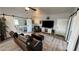 Charming living room with barn doors to bedrooms, a TV, and comfortable seating, perfect for relaxation at 3341 S Big Sky Way, Pahrump, NV 89048