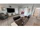 Relaxing living room with a TV, barn doors to other rooms, and stylish decor throughout at 3341 S Big Sky Way, Pahrump, NV 89048
