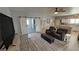 Cozy living room featuring sliding barn doors, comfortable seating, and stylish decor on hard surface floors at 3341 S Big Sky Way, Pahrump, NV 89048