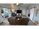 Inviting living room featuring a TV, barn doors to bedrooms, and modern hard surface floors at 3341 S Big Sky Way, Pahrump, NV 89048