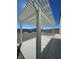Covered patio with concrete flooring that overlooks the gravel area and mountains in the distance at 3341 S Big Sky Way, Pahrump, NV 89048
