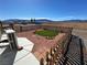 Home exterior featuring a fenced in area with turf and gravel at 3341 S Big Sky Way, Pahrump, NV 89048