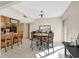 Cozy dining area with a modern light fixture, adjacent to the kitchen and featuring sliding glass doors at 3753 Heritage Ave, Las Vegas, NV 89121
