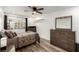 Bedroom with laminate wood flooring, soft natural light, and neutral brown color scheme and furniture at 4401 Lilac Glen Dr, Las Vegas, NV 89129