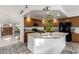 The bright kitchen features a breakfast bar with views through to the entry at 4401 Lilac Glen Dr, Las Vegas, NV 89129