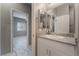 Bathroom featuring a white vanity with granite countertop, sink, and a mirror over the vanity at 4625 Ridgeley Ave # 103, North Las Vegas, NV 89084