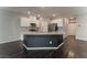 Modern kitchen featuring stainless steel appliances, an island, and white cabinetry at 4625 Ridgeley Ave # 103, North Las Vegas, NV 89084