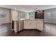 Kitchen island with granite countertops, stainless steel dishwasher, and white cabinets at 4625 Ridgeley Ave # 103, North Las Vegas, NV 89084