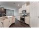 Kitchen area featuring stainless steel oven, sink, and granite countertops at 4625 Ridgeley Ave # 103, North Las Vegas, NV 89084