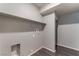 Functional laundry room space with shelving and utility connections at 4625 Ridgeley Ave # 103, North Las Vegas, NV 89084
