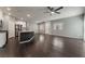 Spacious living area with hardwood floors, ceiling fan, and access to the kitchen at 4625 Ridgeley Ave # 103, North Las Vegas, NV 89084