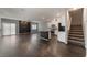 Spacious open-concept living space with modern kitchen and staircase at 4625 Ridgeley Ave # 103, North Las Vegas, NV 89084
