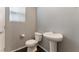 Powder room featuring modern toilet and pedestal sink at 4625 Ridgeley Ave # 103, North Las Vegas, NV 89084