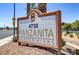 Community sign for Manzanita Condominiums with lush landscaping in front at 4730 E Craig Rd # 1093, Las Vegas, NV 89115