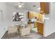 Bright dining area featuring a ceiling fan and a glass top dining table with seating for four at 4730 E Craig Rd # 1093, Las Vegas, NV 89115