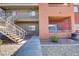 Multi-level condo building with walkways, stairs, and landscaping at 4730 E Craig Rd # 1093, Las Vegas, NV 89115