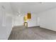 Open concept living space with neutral carpet and paint and pass-through to the kitchen at 4730 E Craig Rd # 1093, Las Vegas, NV 89115