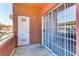 Private outdoor patio with sliding glass door and door to storage area at 4730 E Craig Rd # 1093, Las Vegas, NV 89115