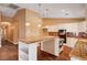 Gourmet kitchen with center island, granite counters and stainless steel appliances at 4775 N Grand Canyon Dr, Las Vegas, NV 89129