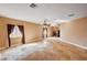Spacious living room with tile flooring, fireplace, and natural light at 4775 N Grand Canyon Dr, Las Vegas, NV 89129