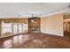 This living room has a ceiling fan and French patio doors to the backyard at 4775 N Grand Canyon Dr, Las Vegas, NV 89129