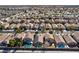 Expansive aerial view capturing a large residential community with numerous homes, pools, and well-kept surroundings at 4900 Cascade Pools Ave, Las Vegas, NV 89131