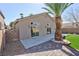 Low maintenance backyard includes a palm tree and large patio area at 4900 Cascade Pools Ave, Las Vegas, NV 89131