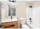 Updated bathroom featuring a modern vanity, arch mirror, and bathtub with white subway tile at 4900 Cascade Pools Ave, Las Vegas, NV 89131
