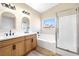 Elegant bathroom with double sinks, soaking tub, and a separate glass shower at 4900 Cascade Pools Ave, Las Vegas, NV 89131
