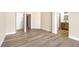 Spacious bedroom boasting beautiful wood-look tile floors, and an ensuite bathroom at 4900 Cascade Pools Ave, Las Vegas, NV 89131