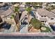 Charming two-story home featuring manicured landscaping, a two-car garage, and mature palm trees in a desirable neighborhood at 4900 Cascade Pools Ave, Las Vegas, NV 89131