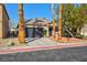 Charming single-story home with a two-car garage and well-manicured landscaping at 4900 Cascade Pools Ave, Las Vegas, NV 89131