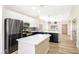 Modern kitchen featuring a large island, stainless steel appliances, and custom cabinetry at 4900 Cascade Pools Ave, Las Vegas, NV 89131