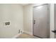 Convenient laundry room showcasing tile floors and hookups at 4900 Cascade Pools Ave, Las Vegas, NV 89131