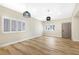 Spacious living room with wood floors, plantation shutters, and stylish light fixtures at 4900 Cascade Pools Ave, Las Vegas, NV 89131