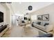 Bright living room featuring modern light fixtures and stylish furniture at 4900 Cascade Pools Ave, Las Vegas, NV 89131