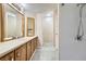 Bathroom showcasing double vanity, walk-in shower, and pristine finishes at 518 Topaz Ave, Henderson, NV 89015
