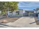 Charming single-story home featuring a well-maintained yard and a convenient covered parking area at 518 Topaz Ave, Henderson, NV 89015