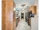 Modern kitchen featuring sleek stainless steel appliances, wood cabinets, and a convenient washer-dryer nook at 518 Topaz Ave, Henderson, NV 89015