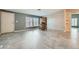 Bright living room featuring neutral walls, tile floors, and an antique hutch for style and storage at 518 Topaz Ave, Henderson, NV 89015