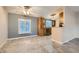 Open-concept living and kitchen area boasts modern flooring and natural light through shuttered windows at 518 Topaz Ave, Henderson, NV 89015