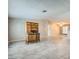 Open-concept living room showcasing modern tile floors and a view into the dining and kitchen areas at 518 Topaz Ave, Henderson, NV 89015