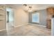 Bright living room featuring vaulted ceiling, large window, and stylish flooring at 518 Topaz Ave, Henderson, NV 89015
