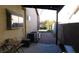 Cozy back patio with outdoor seating, AC unit, and access to a red brick backyard at 5856 Sutcliffe Cir, Las Vegas, NV 89110